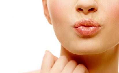 Learn how to heal cracked lips to get healthy, smooth lips like this woman's.