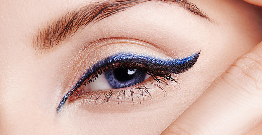 Double winged eyeliner look with black and blue liners.