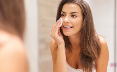 Woman removing face makeup