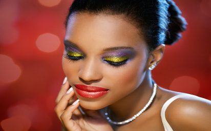 Woman wearing glitter makeup.