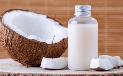 A bottle of soap and a coconut.