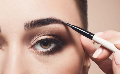 Brow gel is being applied to eyebrows