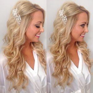 blonde woman with curled hair and fancy silver hair clip
