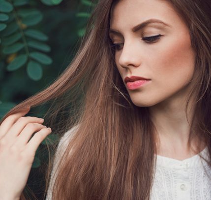 Best Thickening Shampoo: How to Get the Hair You’ve Dreamed Of portrait of a woman with strong healthy hair