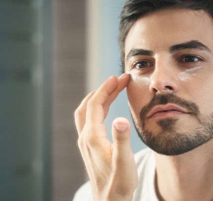Types of Eye Cream: The Benefits of Using a Specialized Cream man applying cream under eyes