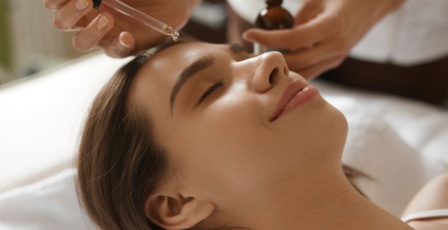 A person getting a hyaluronic acid serum treatment.
