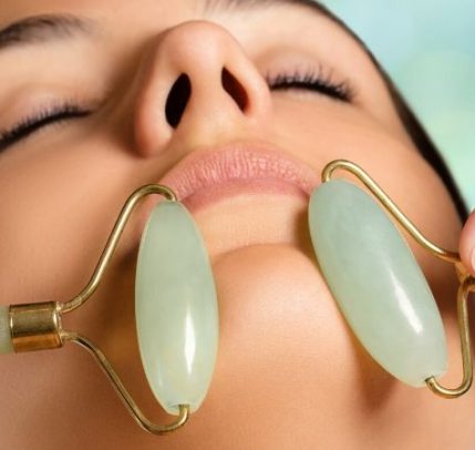Facial rollers Somone is getting a jade facial roller treatment.