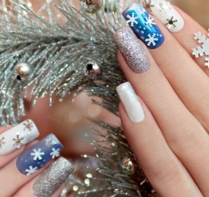 Holiday Nail Designs Someone showing off their holiday nail deisgn.