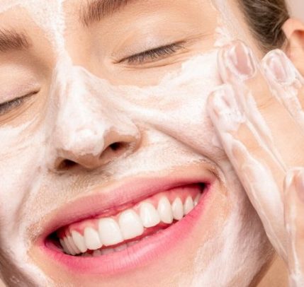 How to get rid of forehead wrinkles Someone washing their face.