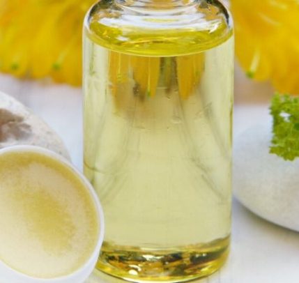 How to exfoliate lips Honey lip balm and a bottle of honey.