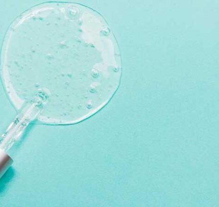 Retinol cream for acne A photo of a pipette laying on it's side with retinol serum pooling around the tip.