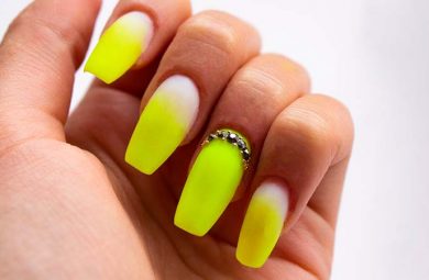 Yellow, acrylic nails.